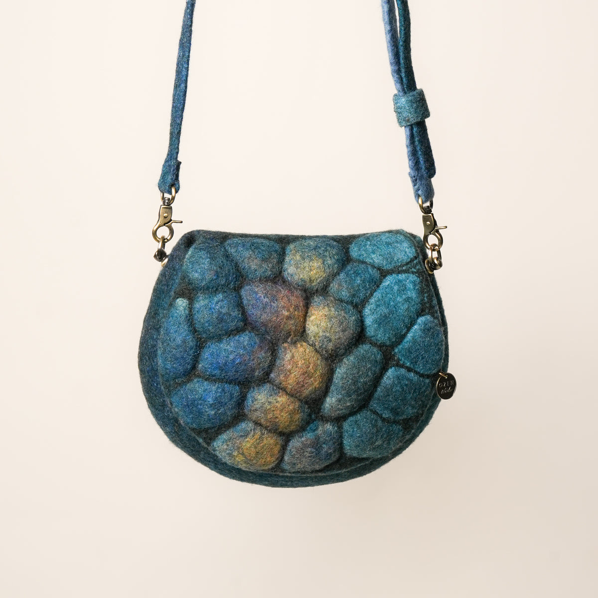 Pebbles Saddle Bag, handmade wet-felted wool, studio photo 5