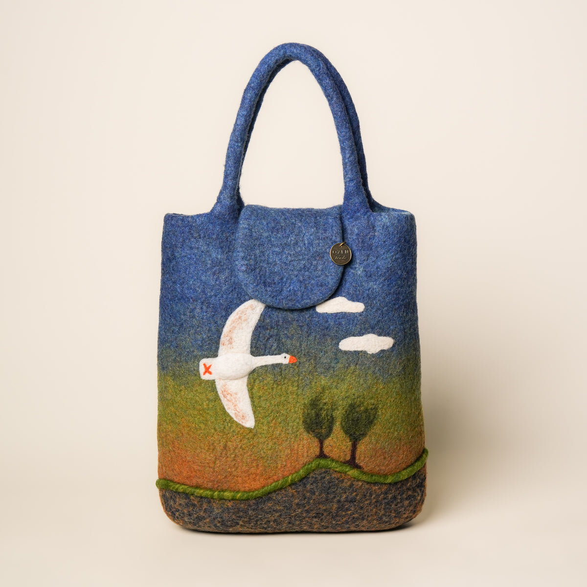 Heron Shopper, handmade wet-felted wool, studio photo 1