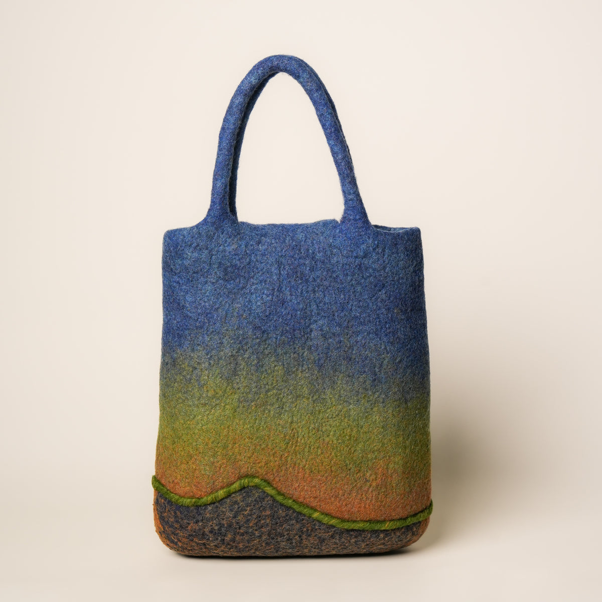 Heron Shopper, handmade wet-felted wool, studio photo 4