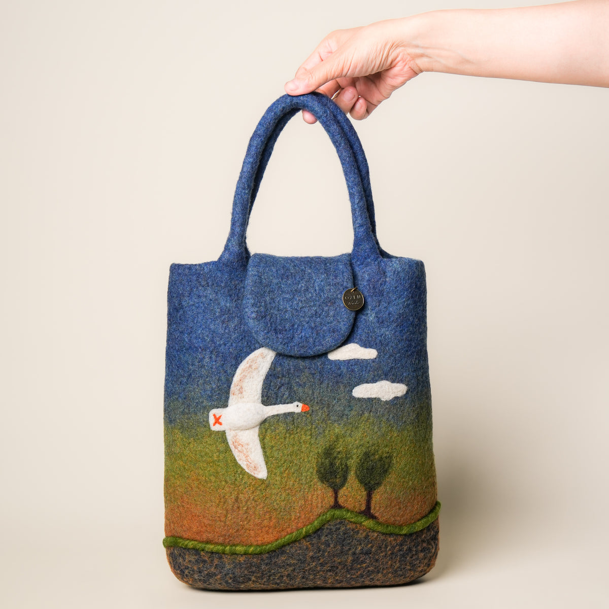 Heron Shopper, handmade wet-felted wool, studio photo 5