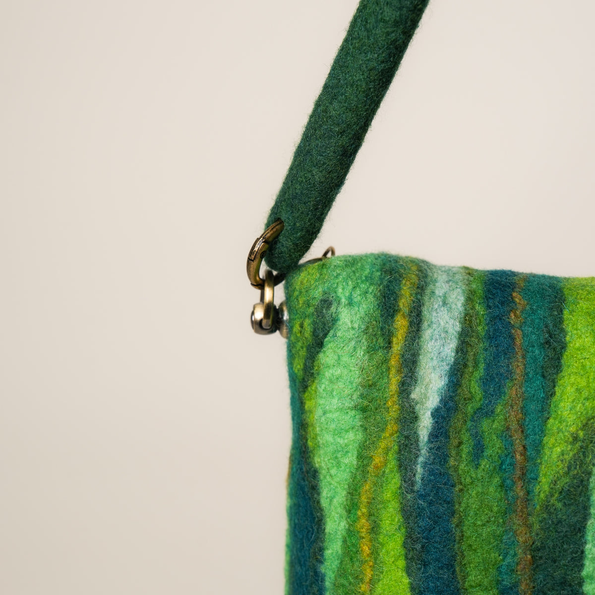 Evergreen Baguette Bag, handmade wet-felted wool, studio photo 3
