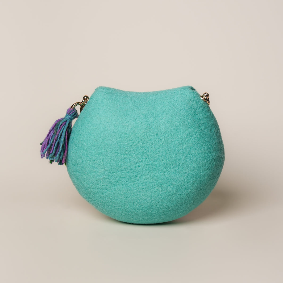Lotus Saddle Bag by Frida Åberg, handmade wet-felted wool, studio photo 4